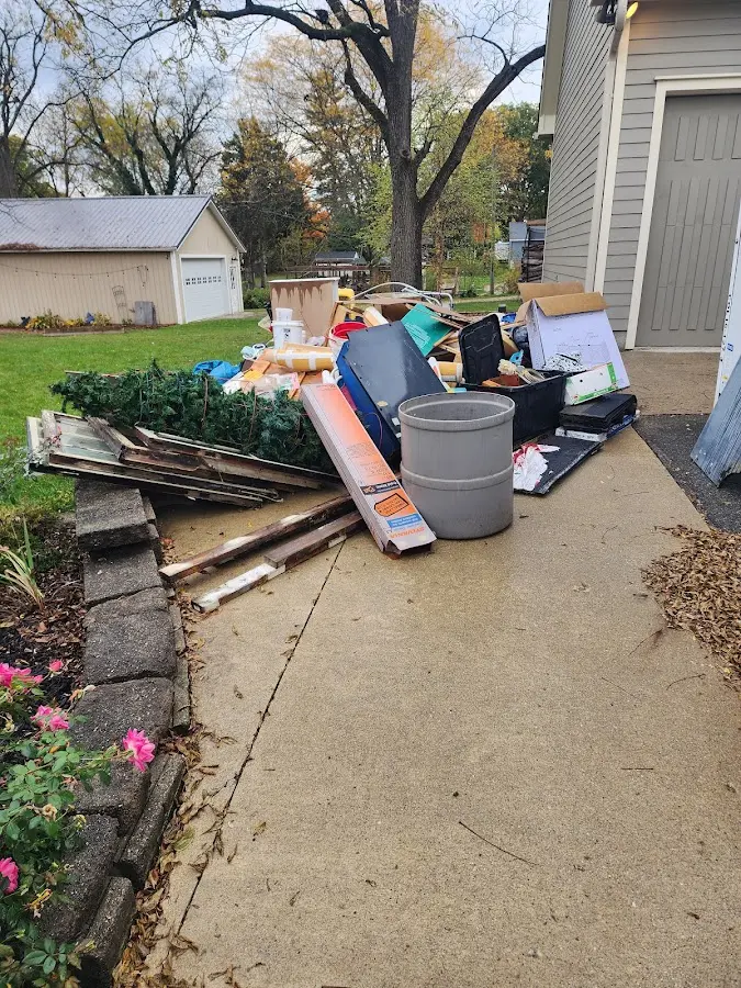 Dumpster being loaded with debris for 3 Yard Dumpster Rental in Beaufort